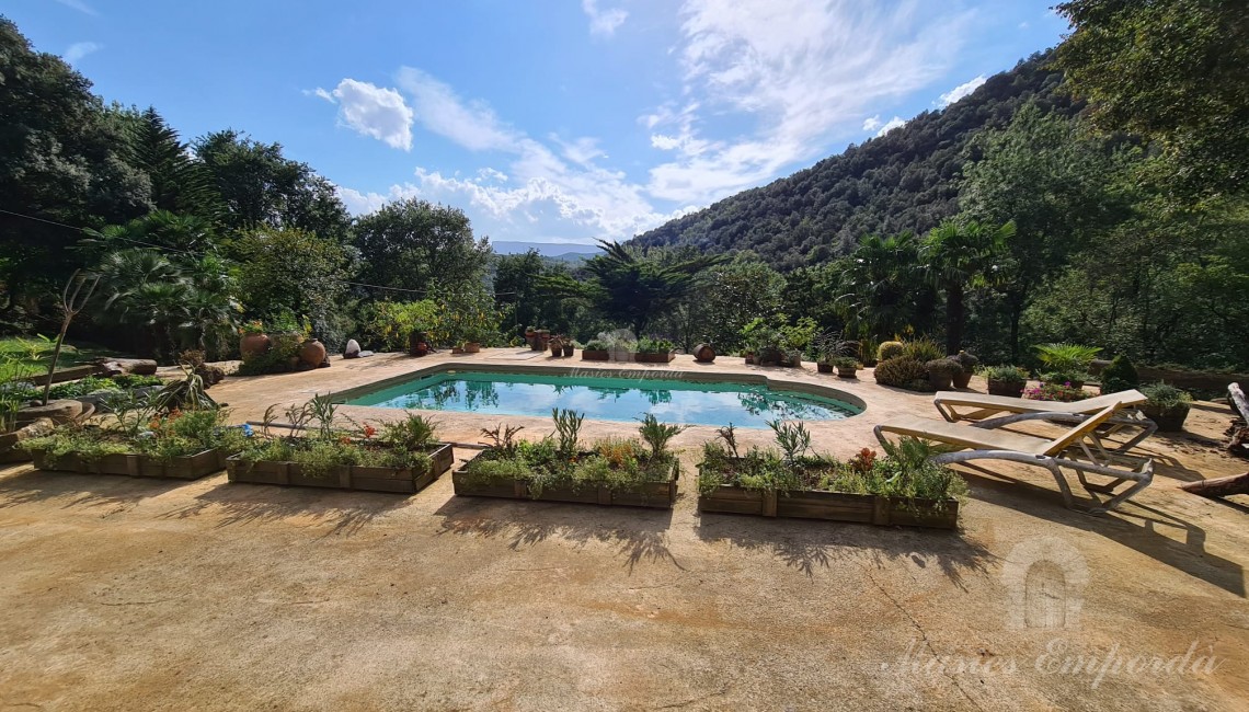 Terrace of the facade of the house with the swimming pool