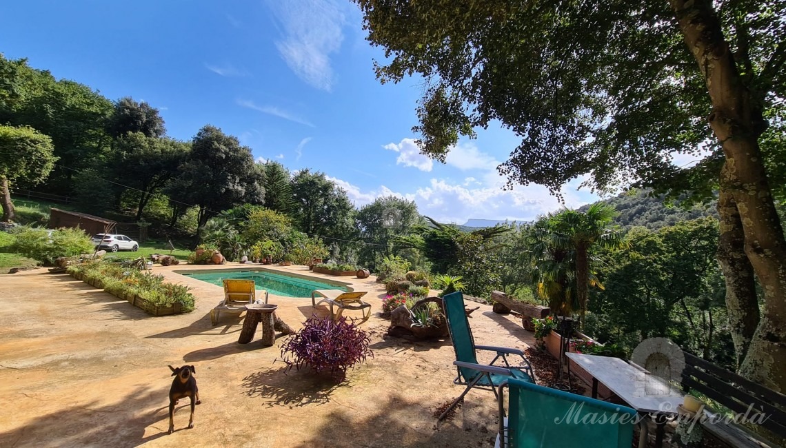 Terrace of the facade of the house with the swimming pool