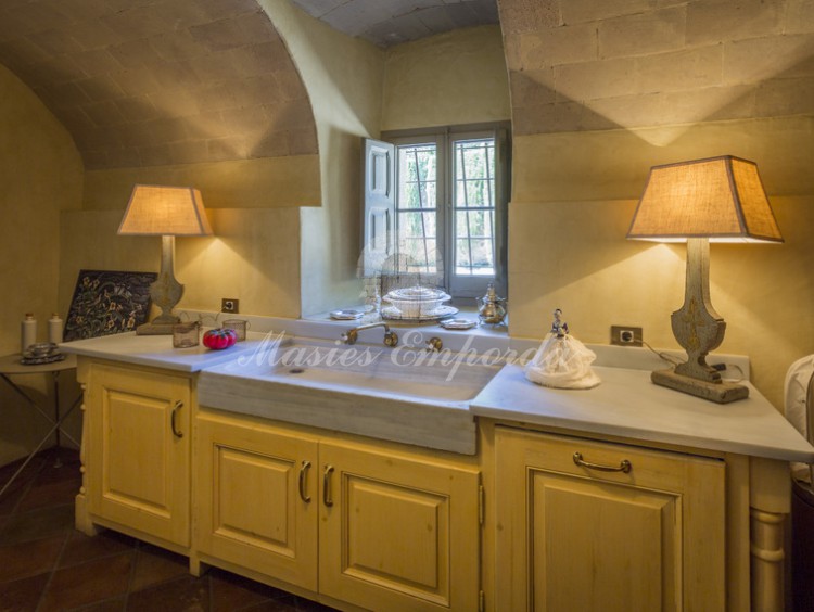 View of the attached service office with vaulted ceilings. 