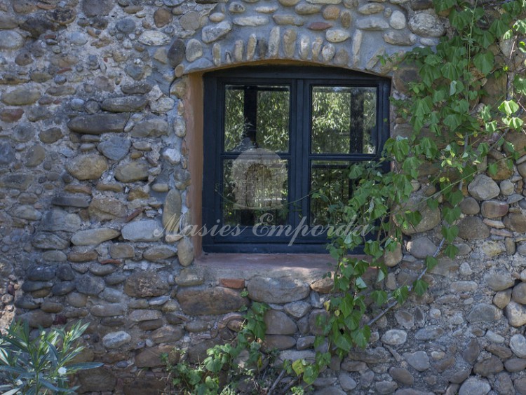 Stone wall and window of the guest house of the guest house