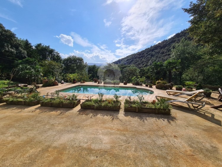 Terrace of the facade of the house with the swimming pool